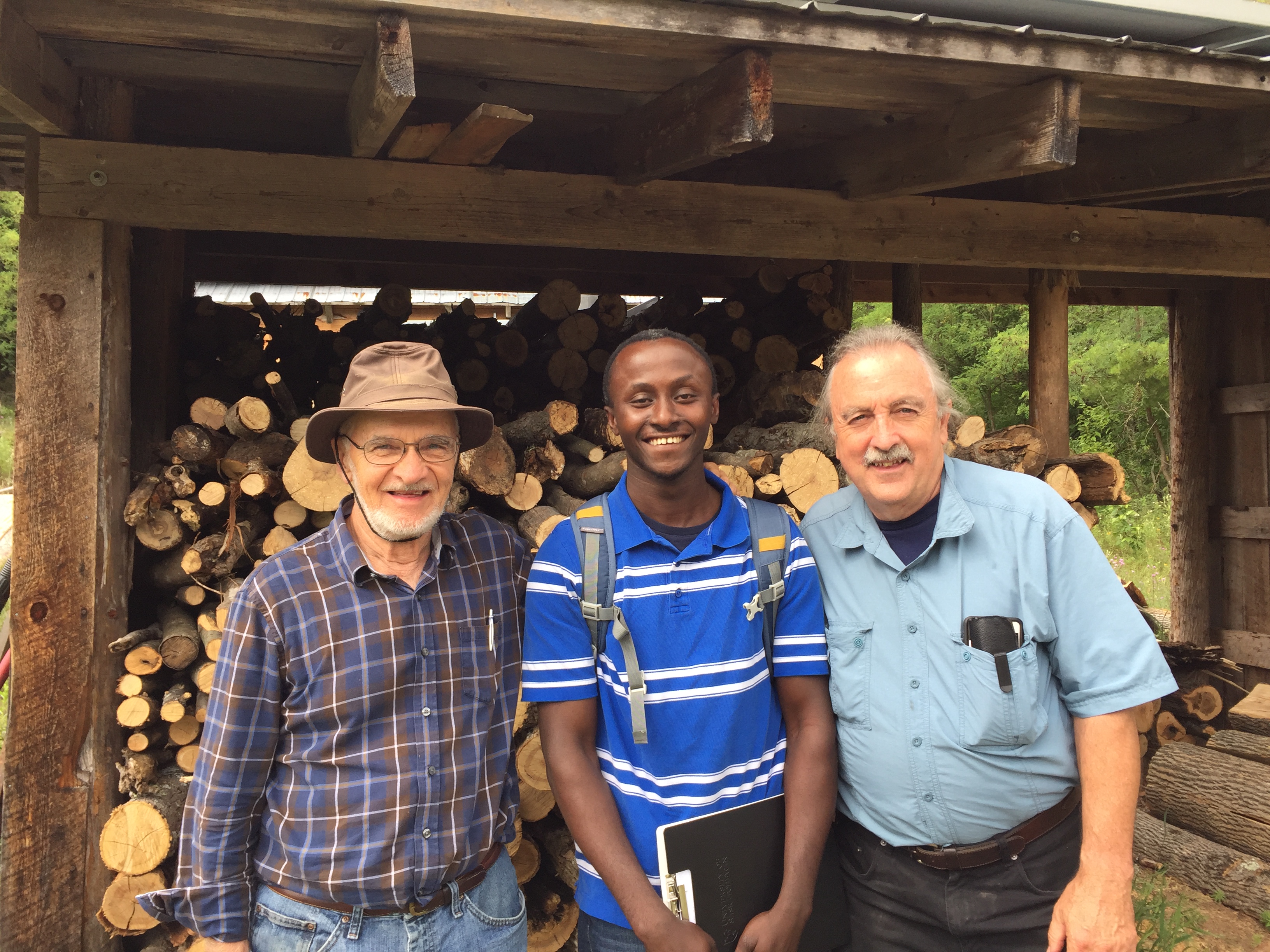 John in a pose with a certified woodlot owner (left) and Larry McDermott (right) the Executive Director of Plenty Canada, a non-profit organization and a certified woodlot owner.